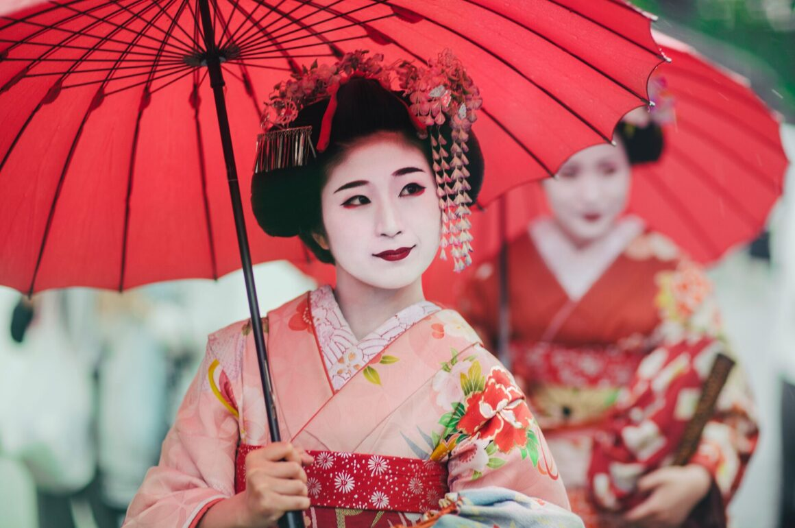 The geisha is a symbol of Japanese elegance, grace, and tradition. 